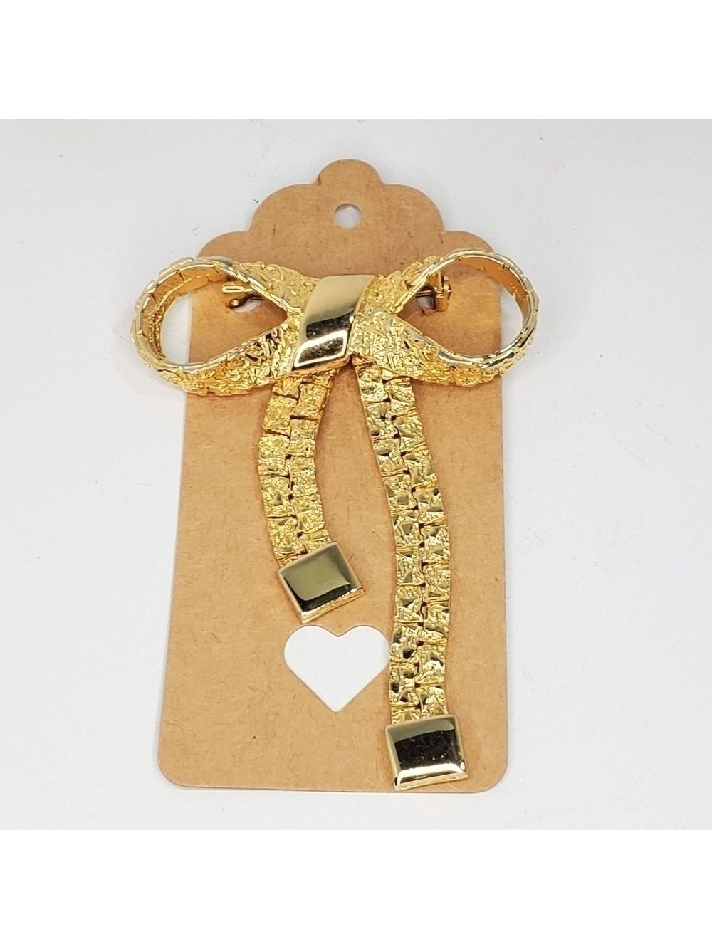 Vintage Goldtone Gold nugget Articulated Bow Brooch